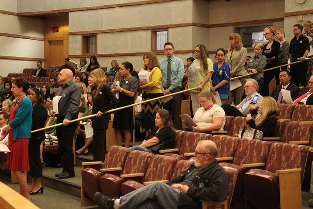 No Kill Las Vegas supporters line up to speak during public comment at a Clark County Commission meeting inside the Clark County Commissioner chambers in Las Vegas Tuesday, March 17, 2015. Clark C ...
