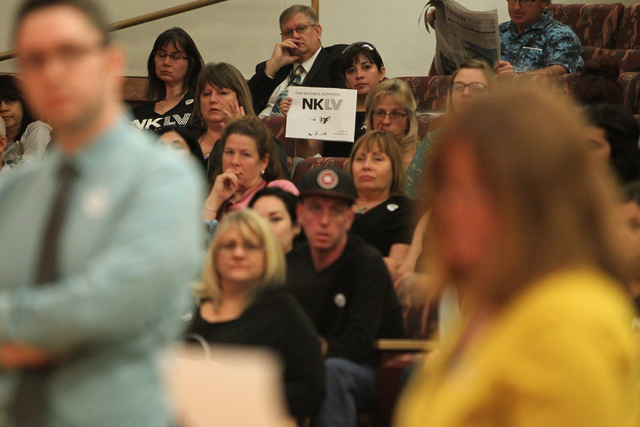 No Kill Las Vegas organization supporters listen during a Clark County Commission meeting inside the Clark County Commissioner chambers in Las Vegas Tuesday, March 17, 2015. Clark County commissio ...
