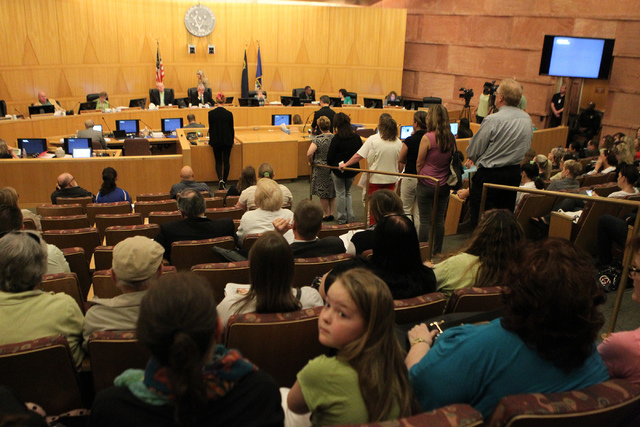 No Kill Las Vegas supporters line up to speak during public comment at a Clark County Commission meeting inside the Clark County Commissioner chambers in Las Vegas Tuesday, March 17, 2015. Clark C ...