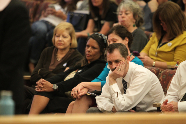 No Kill Las Vegas organization president Bryce Henderson, right, listens during a Clark County Commission meeting inside the Clark County Commissioner chambers in Las Vegas Tuesday, March 17, 2015 ...