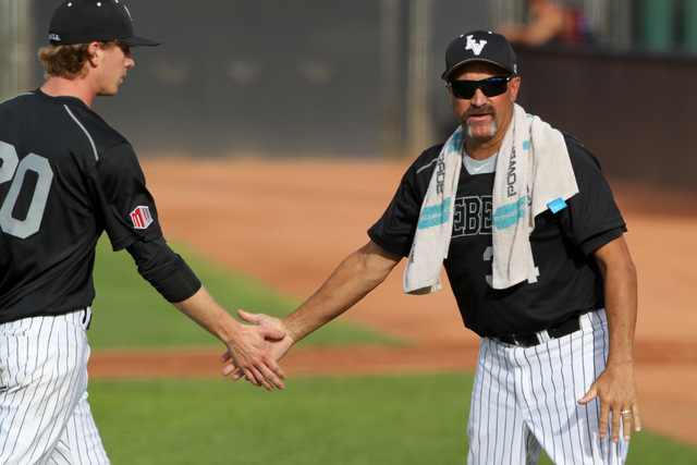 UNLV head coach Tim Chambers congratulates pitcher Blaze Bohall after an inning during their 7-1 defeat of Grand Canyon University Tuesday, March 17, 2015 at Earl E. Wilson Stadium. (Sam Morris/La ...
