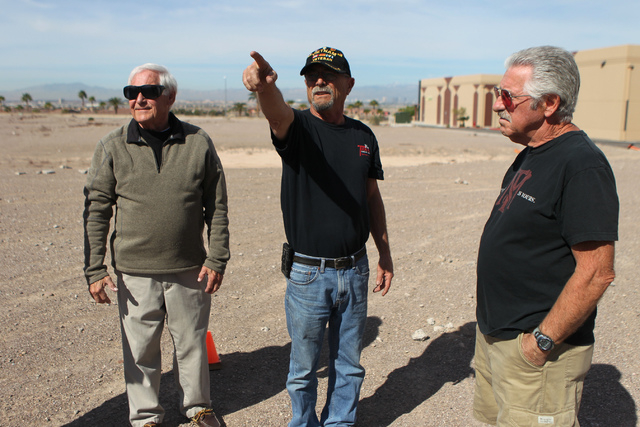 Ridge View Industrial Park building owner Howard Howe, center, points to his home, with Jim Anderson, left, president for Calico Ridge Home Owners Association, and Craig Bauske, building owner at  ...