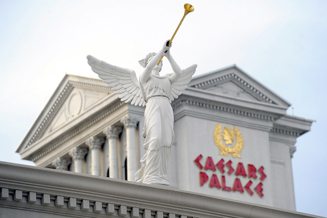 A statue on display is seen in front of Caesars Palace hotel-casino on Thursday, Dec. 11, 2014, in Las Vegas. (David Becker/Las Vegas Review-Journal)