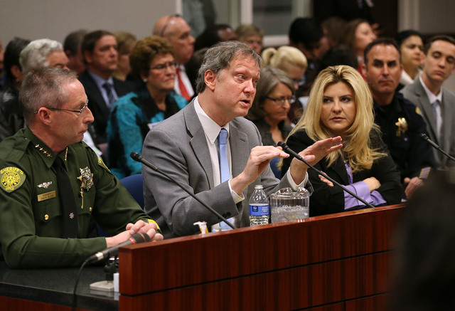 Washoe County Sheriff Chuck Allen, left, John Lott, an academic and president of an organization called the Crime Prevention Research Center, and Assemblywoman Michele Fiore, R-Las Vegas, urge law ...