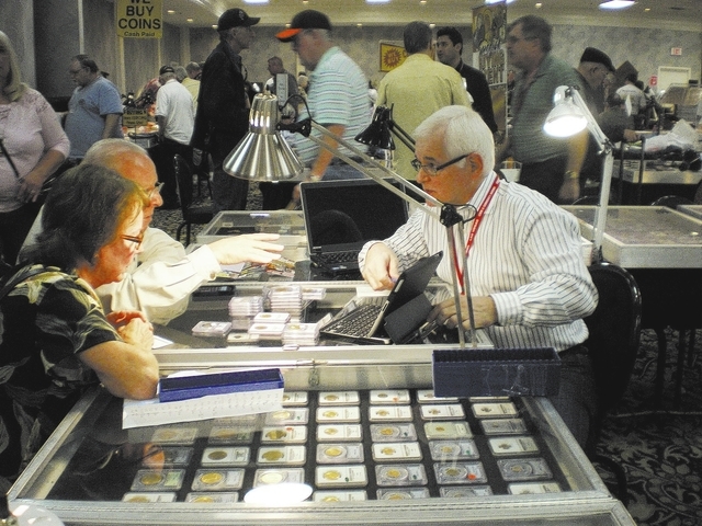 Bob Higgins, right, gives an appraisal at a previous Las Vegas Numismatic Society coin show. This year's show is scheduled from 10 a.m. to 6 p.m. March 20 and 21 and 10 a.m. to 3 p.m. March 22 at  ...