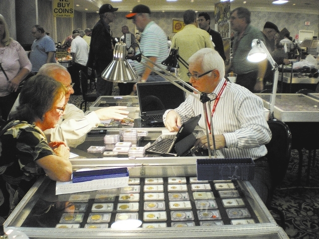 Bob Higgins, right, gives an appraisal at a previous Las Vegas Numismatic Society coin show. This year's show is scheduled from 10 a.m. to 6 p.m. March 20 and 21 and 10 a.m. to 3 p.m. March 22 at ...