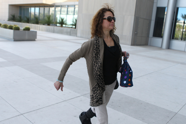 Edith Gillespie, co-defendant in a federal case involving fraud and corruption at Las Vegas homeowners associations, walks to Lloyd George Federal Courthouse in Las Vegas Wednesday, Feb. 25, 2015. ...