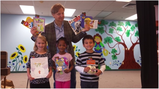 Mac King poses with students at Bunker Elementary School during Nevada Reading Week on March 4, 2015. Each student at the school was able to take a book home to keep courtesy of Mac King’s Magic ...