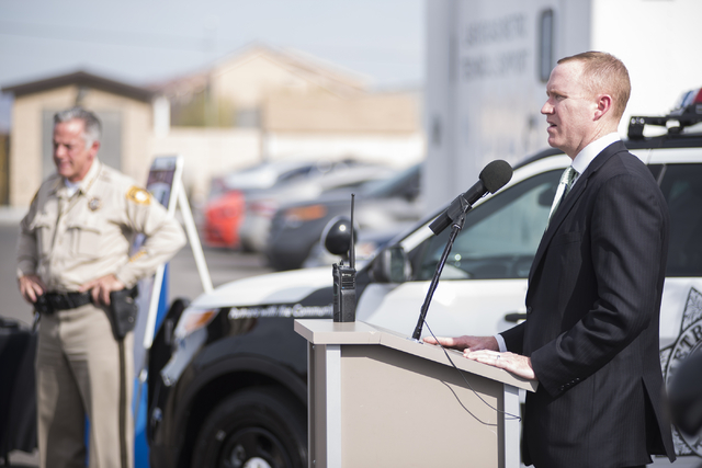 Motorola Solutions Vice President Jack Molloy right, talks about the Las Vegas police department's radio system as he speaks about a partnership with police at the Enterprise Area Command in Las V ...