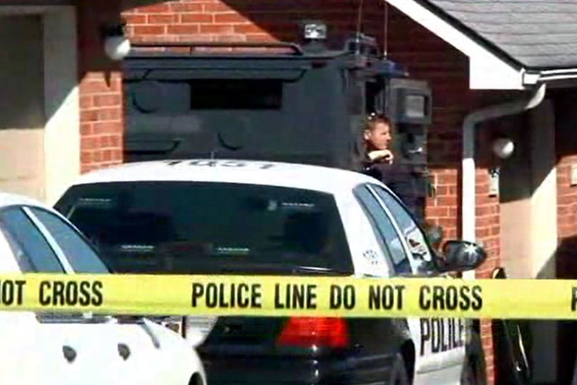 A father and his two children, ages 2 and 4, were found dead in a Springfield, Missouri, apartment after a 24-hour standoff with police, Monday, March 16, 2015. (Screengrab/KCTV)