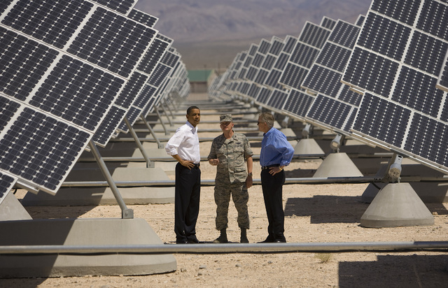 President Barack Obama, left, stands with, continuing from left, U.S. Air Force Col. Howard Belote and U.S. Senate Majority Leader Harry Reid, D-Nev., during a tour of the Nellis Air Force Base So ...