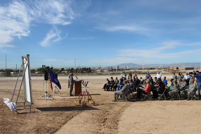 People participate during a ground breaking ceremony for the Nellis Solar Array II project at Nellis Air Force Base in Las Vegas Tuesday, March 24, 2015. The 15 megawatt panels designed by SunPowe ...