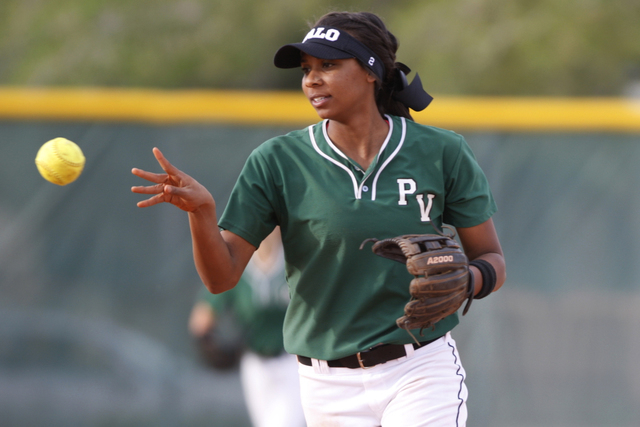 Palo Verde's Dejanae Gage (2) throws the ball after making a catch to end the inning in their softball game against Rancho at Rancho High School in Las Vegas Tuesday, March 17, 2015. Palo Verde wo ...