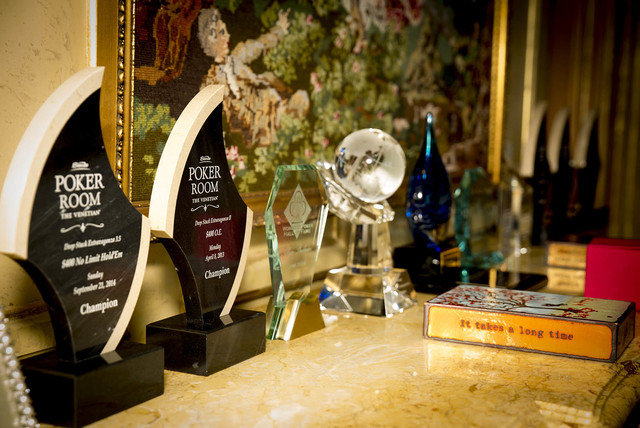 Tonya Harvey/Real Estate Millions 
Las Vegas’ premier poker couple, Barry and Allyn Shulman, display some of their awards in their three-floor penthouse in the Metropolis.