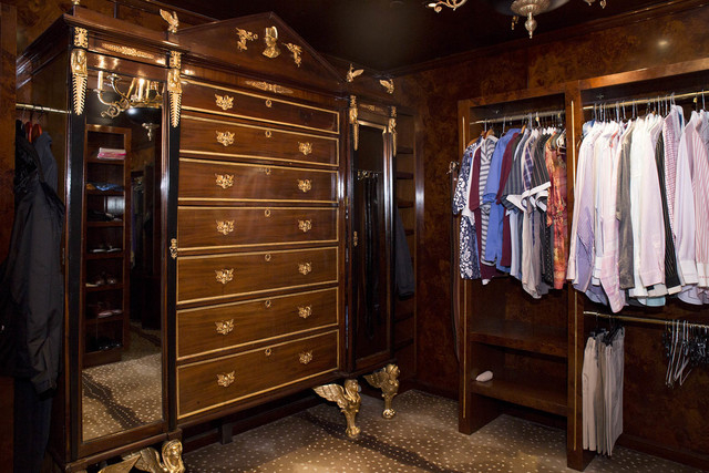 Tonya Harvey/Real Estate Millions 
The walls of Barry’s closet are paneled with burl birch wood, and hold a large armoire with gilded Egyptian feet and other details, imported from Europe.