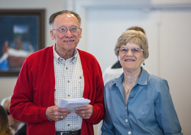 Ted Hover And His Wife Dorothy Pose For Their Portrait While Giving Out