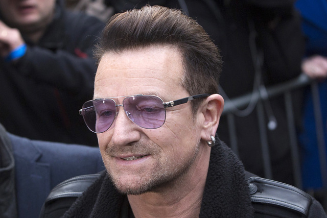 U2 lead singer Bono arrives for the recording of the Band Aid 30 charity single in west London November 15, 2014. (REUTERS/Neil Hall)
