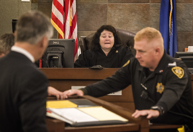 District Judge Elizabeth Gonzalez watches while a podium is moved before Las Vegas Sands Corp. Chairman and CEO Sheldon Adelson,  testifies at Clark County Justice Center on Tuesday, April 28,2015 ...