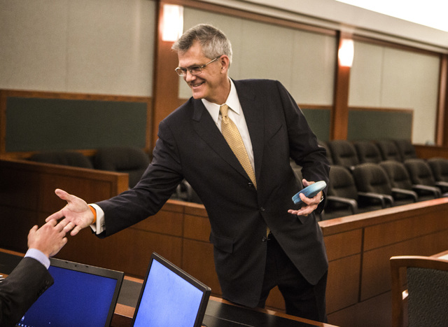Steven Jacobs,  former president of Sands Macau, greets a member of his counsel during his wrongful termination case against Las Vegas Sands Corp. at Clark County Justice Center on Tuesday, April  ...