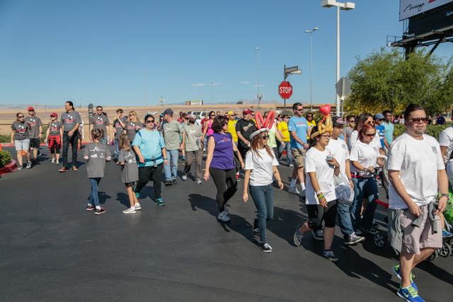 Participants walk the course during the Aid for AIDS of Nevada (AFAN) 25th Annual AIDS Walk Las Vegas at Town Square Las Vegas, South Las Vegas Boulevard,  Las Vegas, Sunday, April 19, 2015. (Dona ...