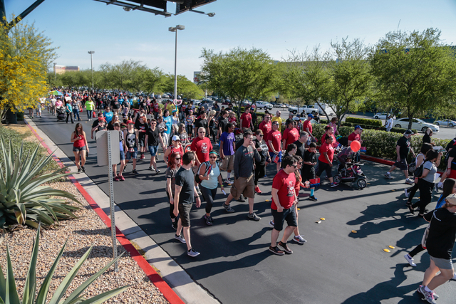 Participants walk the course during the Aid for AIDS of Nevada (AFAN) 25th Annual AIDS Walk Las Vegas at Town Square Las Vegas, South Las Vegas Boulevard,  Las Vegas, Sunday, April 19, 2015. (Dona ...