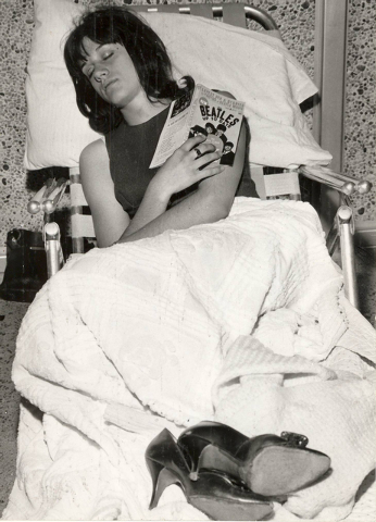 A fan of the British rock 'n' roll band The Beatles camps overnight outside the Las Vegas Convention Center, June 29, 1964, as she waits for concert tickets to go on sale. (Terry Todd/Las Vegas Re ...