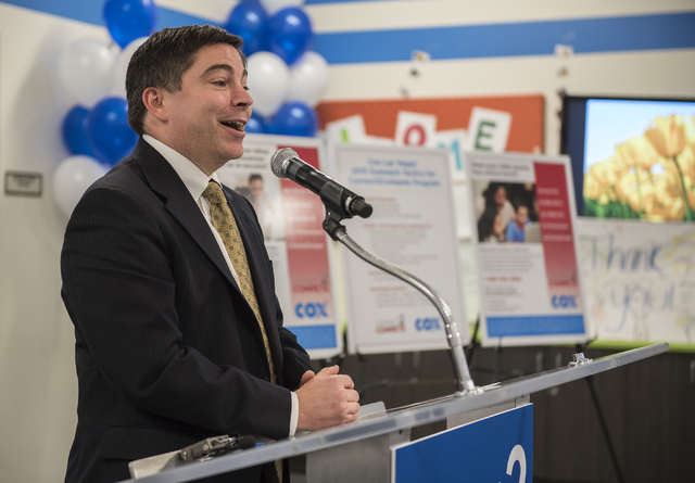 Commissioner Michael O'Rielly of the Federal Communications Commission (FCC) speaks to the news media during an announcement for the Connect2Compete program at a ribbon cutting ceremony for the Co ...