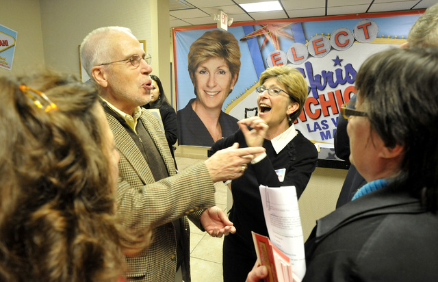 Gary Gray, left, jokes with his wife, Clark County Commissioner Chris Giunchigliani, and campaign volunteers at Giunchigliani's campaign headquarters in Las Vegas, Saturday, Feb. 26, 2011, when sh ...