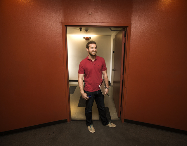 Resort Gaming Group project manager John Curran stands in the hallway in 211 at 211 8th Street on Thursday, April 16, 2015. The Downtown Project will soon be renting small renovated apartments in  ...