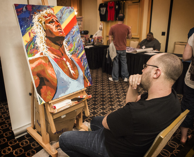 Artist Rob Schamberger studies his painting of pro wrestler Kurt Hennig on Wednesday, April 15, 2015 during the  Cauliflower Alley Club convention at the Gold Coast Hotel and Casino Las Vegas, 400 ...