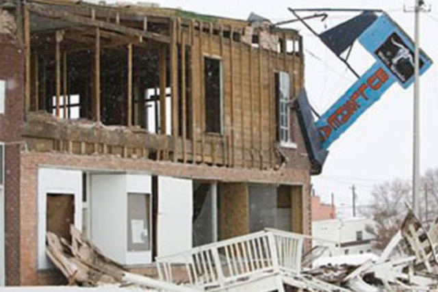Historic buildings on Front Street in Wells, Nev., show heavy damage Feb. 21, 2008, after an ea ...