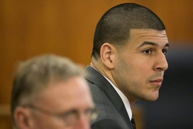 Former NFL player Aaron Hernandez listens during his murder trial at the Bristol County Superior Court in Fall River, Massachusetts, Wednesday, April 15, 2015. Hernandez was found guilty Wednesday ...