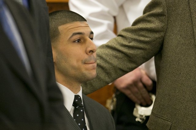 Former NFL player Aaron Hernandez listens as the guilty verdict is read during his murder trial at the Bristol County Superior Court in Fall River, Massachusetts, April 15, 2015. Hernandez, 25, a ...