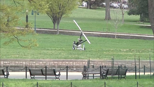 A small helicopter is pictured in this still image taken from video after it landed on the west lawn of the U.S. Capitol in Washington April 15, 2015. One person was detained and nearby streets we ...
