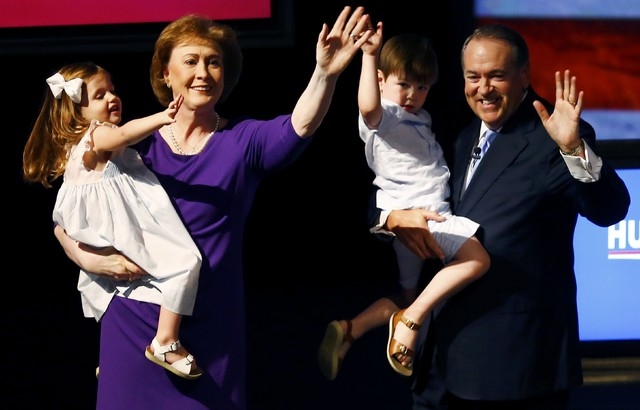 U.S. Republican presidential candidate, and former Arkansas Governor Mike Huckabee, holding his grandson Chandler, formallly launches his bid for the 2016 Republican presidential nomination during ...