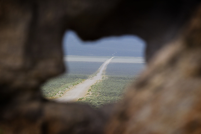 A barren road shot through a rock outcropping is seen Wednesday, May 20, 2015, in Garden Valley, over a three-hour drive north of Las Vegas. Over 800,000 acres in central Nevada is proposed as the ...