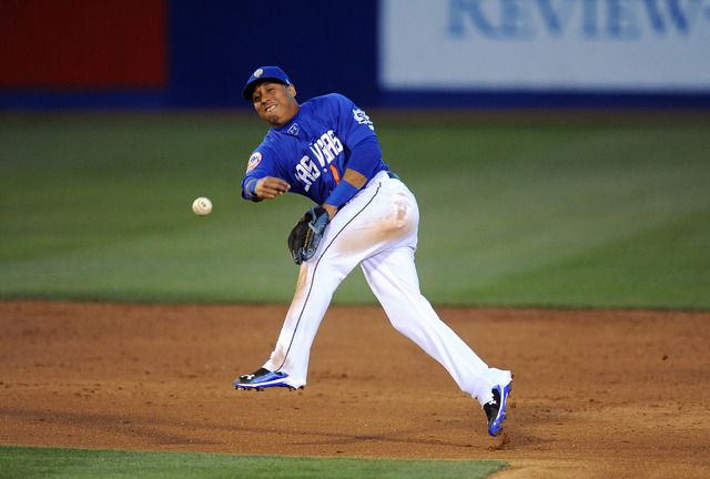 Las Vegas 51s  second baseman Wilfredo Tovar throws out an Oklahoma City Dodgers base runner at first base in the third inning of their Triple-A minor league baseball game at Cashman Field in Las  ...