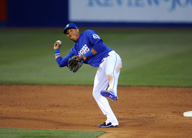 Las Vegas 51s  second baseman Wilfredo Tovar throws out an Oklahoma City Dodgers base runner at first base in the third inning of their Triple-A minor league baseball game at Cashman Field in Las  ...