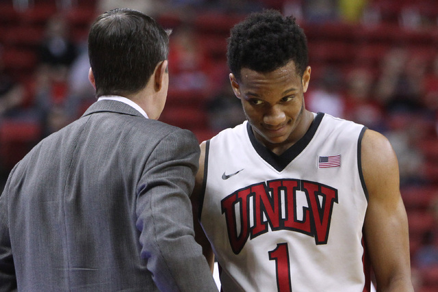 UNLV coach Dave Rice talks with Rashad Vaughn last season. A 30-second clock would benefit players such as Vaughn, who are capable of creating a shot at the end of a now faster clock. “More than ...