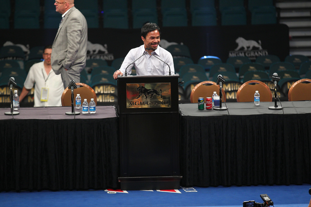 Manny Pacquiao speaks with news media following his defeat by Floyd Mayweather Jr. after their welterweight unification boxing match at the MGM Grand Garden Arena in Las Vegas on Saturday, May 2, ...