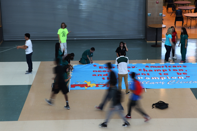 Students set up a banner inside Rancho High School in North Las Vegas for a campaign visit by Democratic presidential candidate Hillary Clinton Tuesday, May 5, 2015. (Erik Verduzco/Las Vegas Revie ...