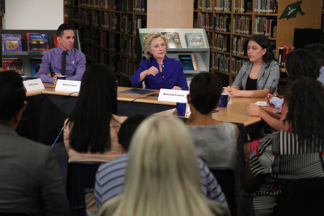 Democratic presidential candidate Hillary Clinton, center, speaks at Rancho High School in North Las Vegas during a round table discussion on immigration Tuesday, May 5, 2015. (Erik Verduzco/Las V ...