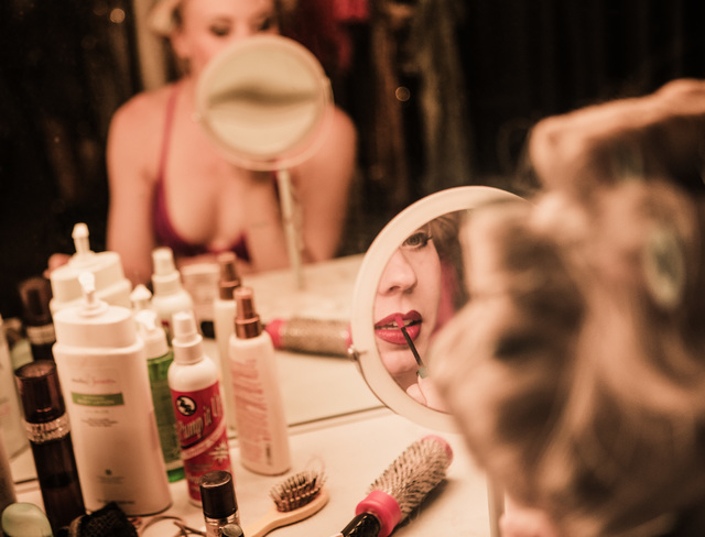 "Crazy Girls" dancer Michelle Davis puts on makeup before the final show at the Riviera hotel-casino on Friday, May 1, 2015. After 28 years the show is closing and moving to Planet Hollywood. (Jef ...
