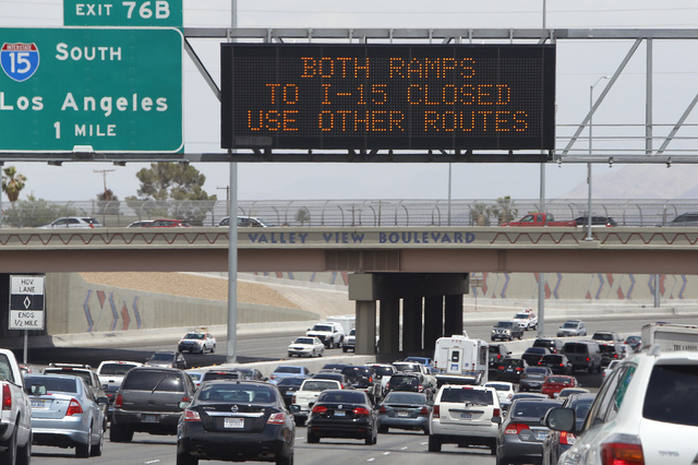Electronic highway signs displays the closure of both I-15 ramps, as officials from the Nevada Department of Transportation and Nevada Highway Patrol investigate possible damage on the ramp from s ...
