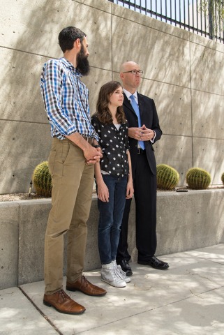 Mackenzie Fraiser, a sixth-grader at Somerset Academy, her father Tim Fraiser, left, and Jeremy Dys, senior counsel for religious rights law firm Liberty Institute, speak with reporters at a news  ...