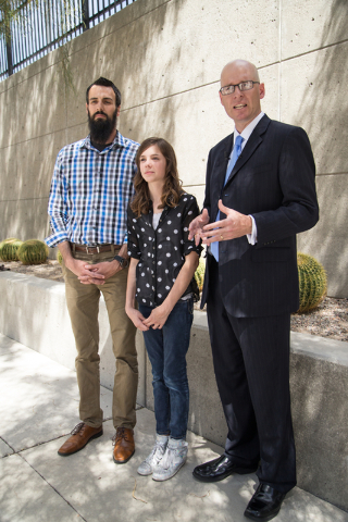 Mackenzie Fraiser, a sixth-grader at Somerset Academy, her father, Tim Fraiser, left, and Jeremy Dys, senior counsel for religious rights law firm Liberty Institute, speak with reporters at a news ...