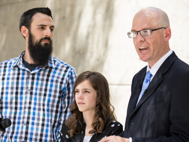 Mackenzie Fraiser, a sixth-grader at Somerset Academy, her father, Tim Fraiser, left, and Jeremy Dys, senior counsel for religious rights law firm Liberty Institute, speak with reporters at a news ...