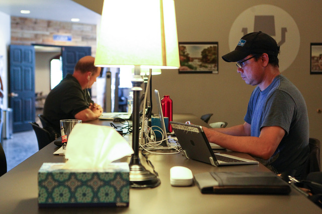 People, including Quint Rahaman, right, work in open office spaces at Work in Progress, 317 6th St., in downtown Las Vegas on Tuesday, May 5, 2015. Work in Progress offers work stations and and st ...