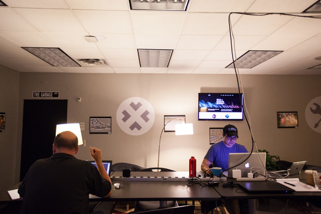 People, including Quint Rahaman, right, work in open office spaces at Work in Progress, 317 6th St., in downtown Las Vegas on Tuesday, May 5, 2015. Work in Progress offers work stations and and st ...