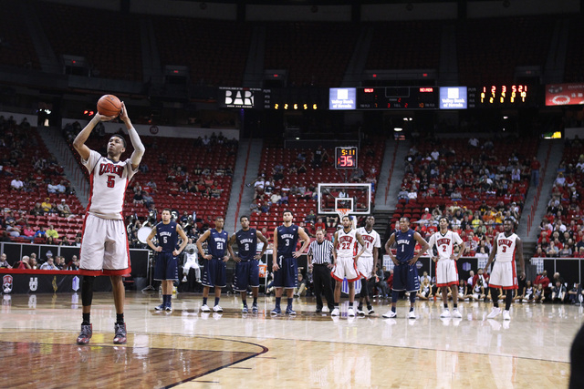 UNLV forward Chris Wood shoots a free throw after UNR guard Marqueze Coleman was called for a technical foul during the second half of their Mountain West Conference tournament game Wednesday, Mar ...